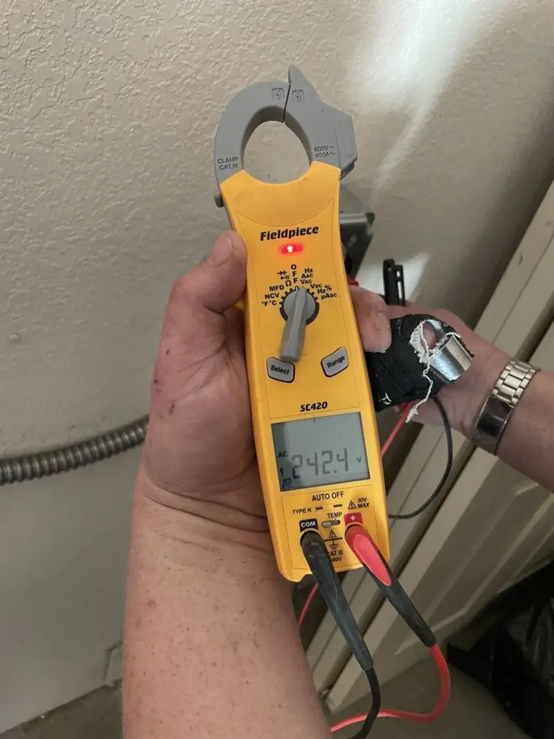 Voltage testing with clamp meter during Generator Installation in Fort Pierce